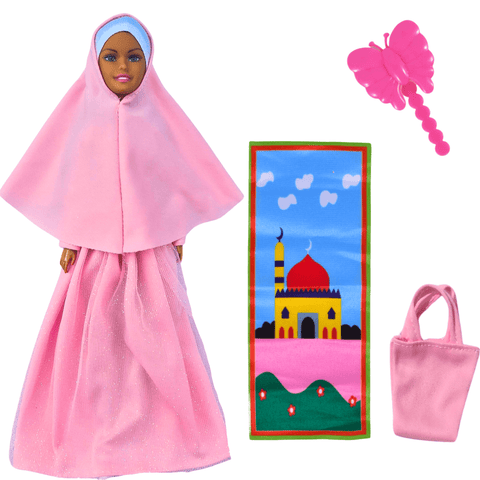 Muslim doll in pink hijab with prayer mat, handbag, and butterfly accessory from modest fashion set.