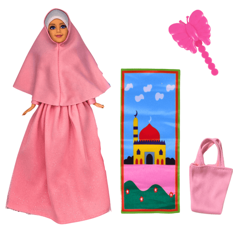 Muslim doll in pink hijab with modest fashion outfit, prayer mat, bag, and butterfly accessory.
